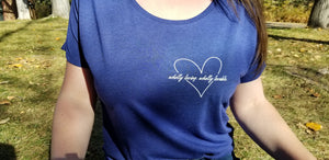 Close-up of the "Wholly loving, wholly lovable" t-shirt in blue.